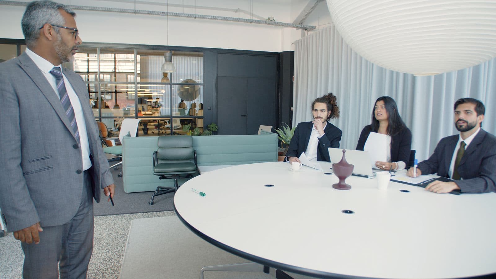 Team meeting around a table in a modern office