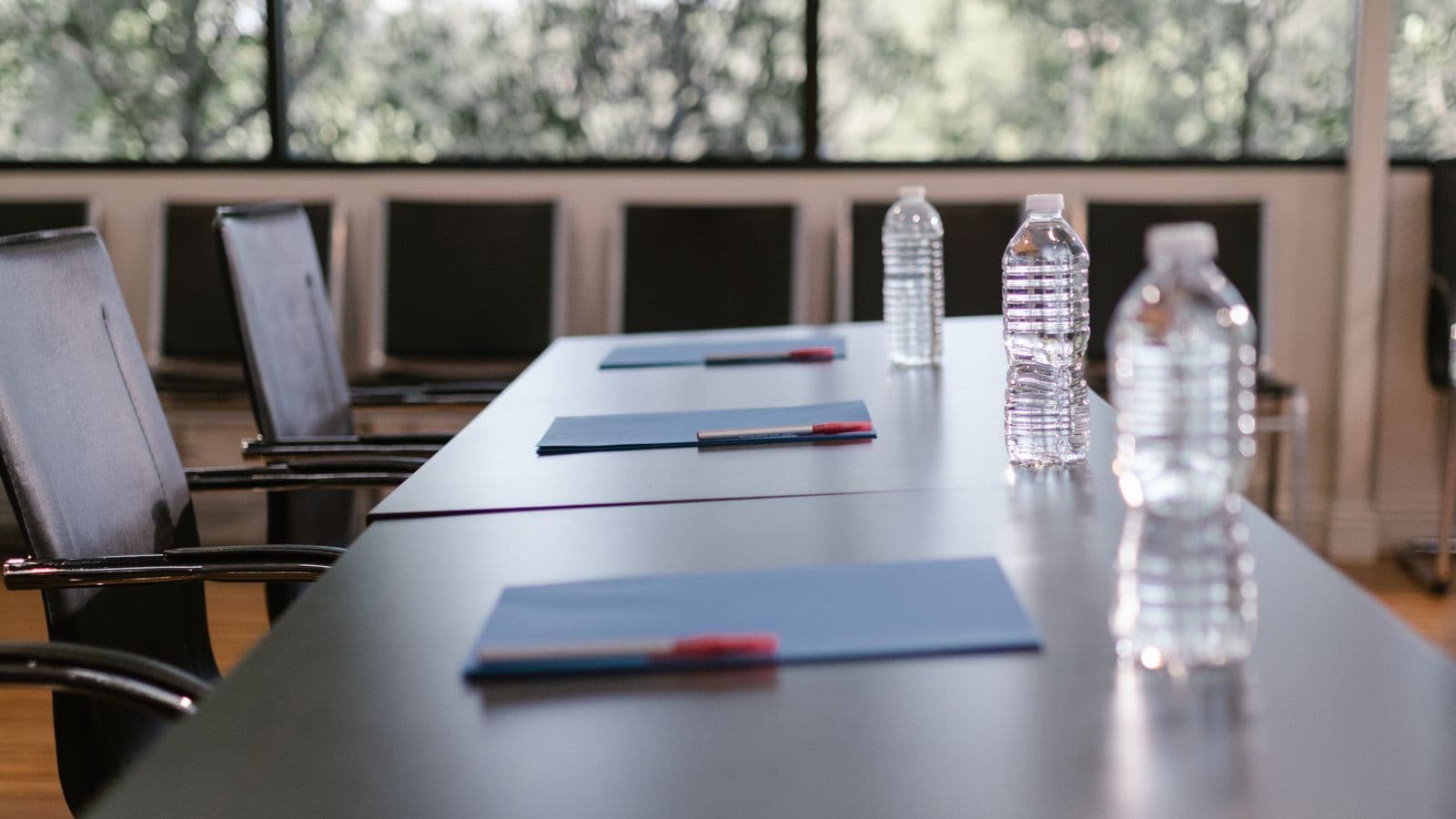 A hotel meeting room set up for a corporate group session