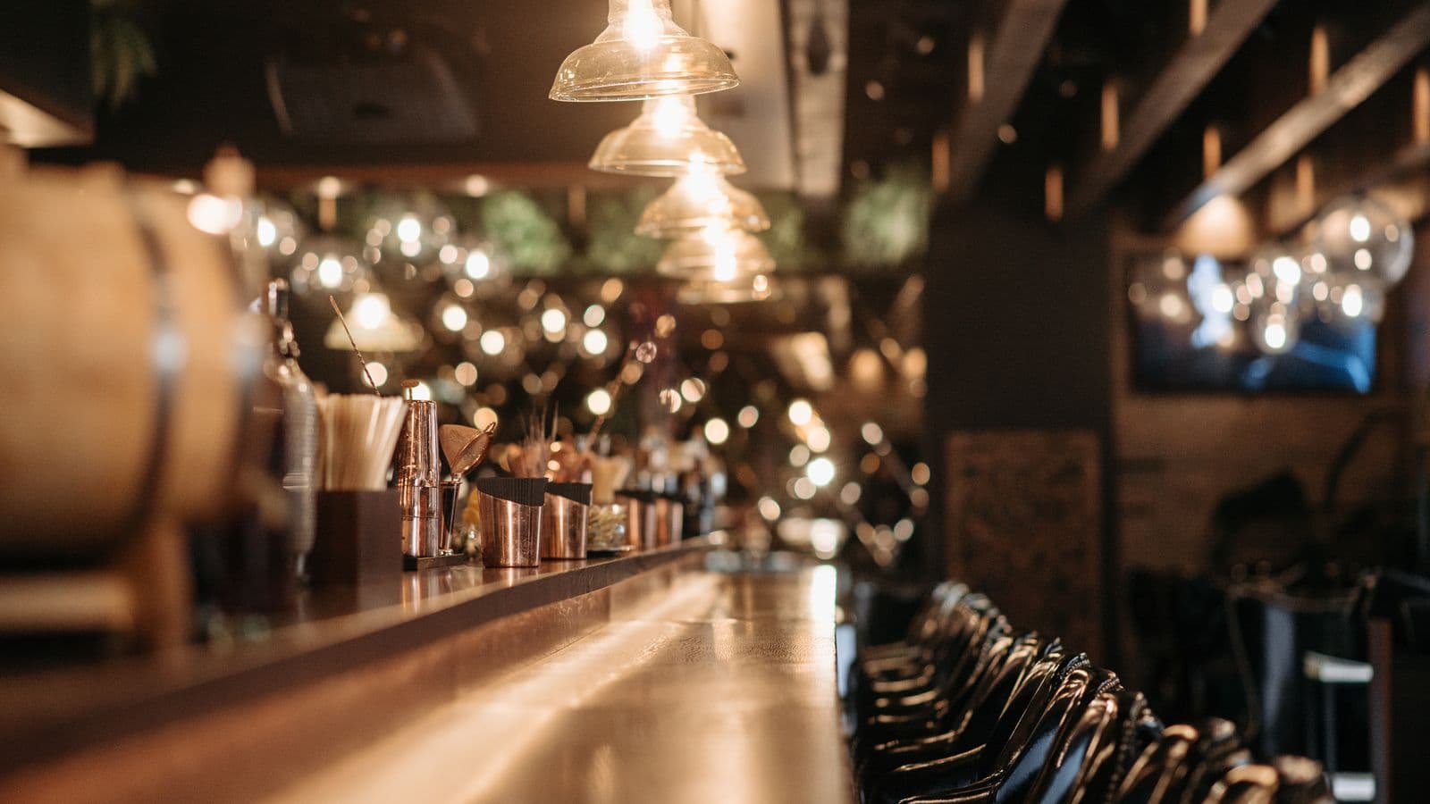 Empty reserved table setting in a dimly lit restaurant