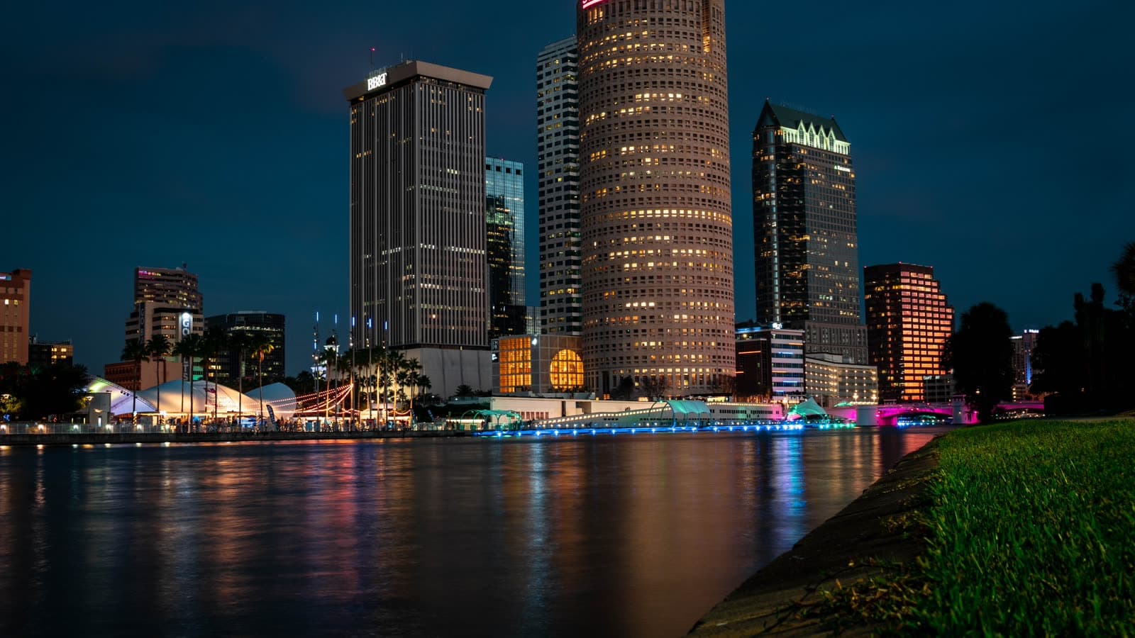 The downtown Tampa skyline lit up across the Hillsborough River at night