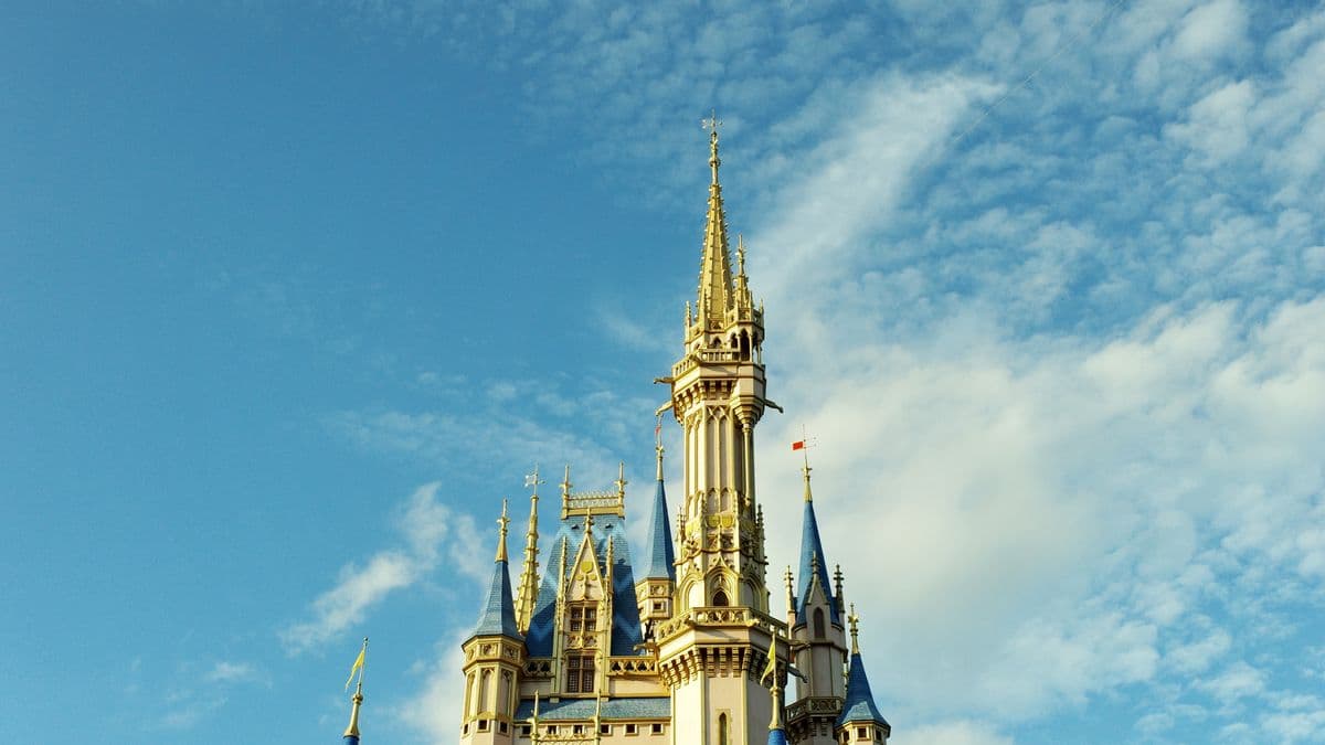 Cinderella Castle spires against a blue sky at Walt Disney World